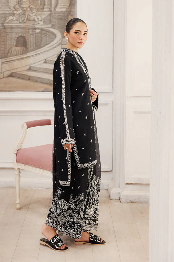 Model wearing Twilight Dreams by Saffron in black with silver embroidery – elegant Pakistani luxury pret outfit available online in UK.
