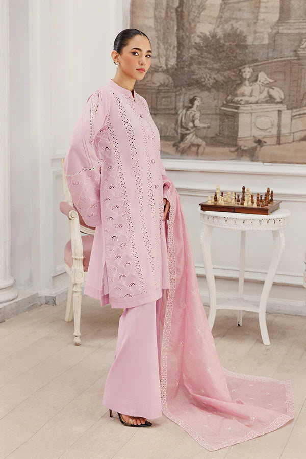 Model wearing Soft Petals by Saffron in pastel pink with delicate cutwork – chic Pakistani luxury pret outfit available online in UK.