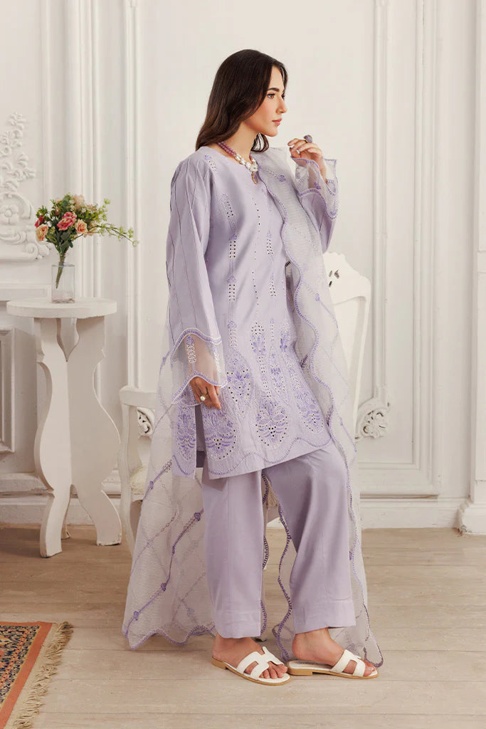 Model wearing Lilac Dust by Saffron in soft lavender with intricate detailing – Pakistani luxury pret outfit online in UK.