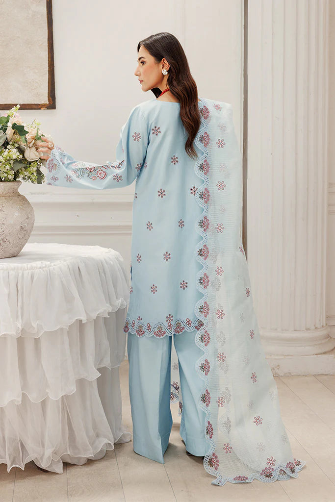 Model wearing Blush Skies by Saffron in pastel blue with delicate embroidery – premium Pakistani luxury pret outfit online in UK.