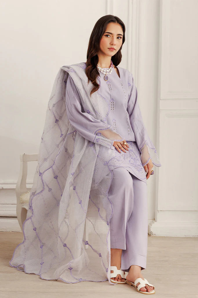 Model wearing Lilac Dust by Saffron in soft lavender with intricate detailing – Pakistani luxury pret outfit online in UK.