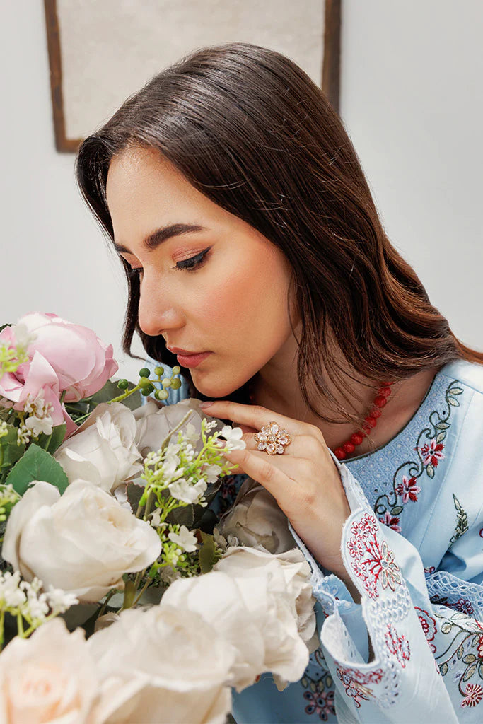 Model wearing Blush Skies by Saffron in pastel blue with delicate embroidery – premium Pakistani luxury pret outfit online in UK.