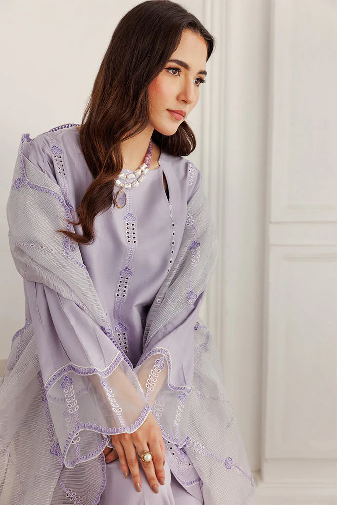 Model wearing Lilac Dust by Saffron in soft lavender with intricate detailing – Pakistani luxury pret outfit online in UK.
