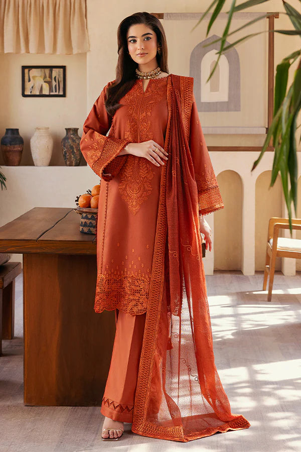 Model wearing rust orange embroidered dress from Saffron Summer Soiree '25 Delilah, Pakistani luxury pret available online in UK.