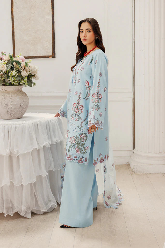 Model wearing Blush Skies by Saffron in pastel blue with delicate embroidery – premium Pakistani luxury pret outfit online in UK.