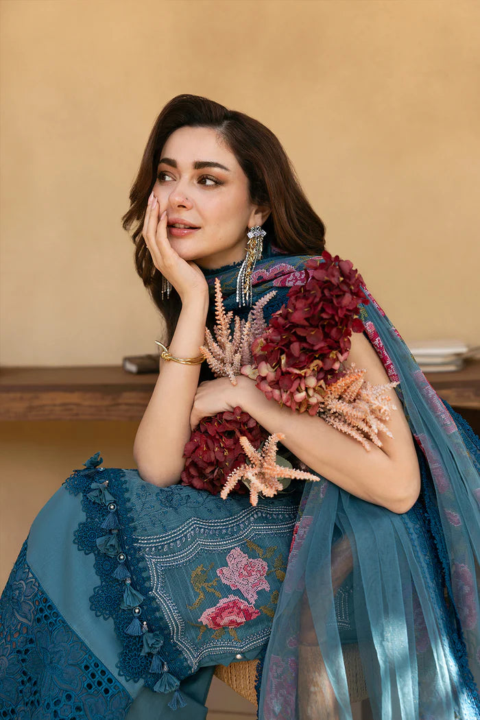 Model wearing teal blue sleeveless embroidered dress with floral pink dupatta from Saira Rizwan, Pakistani luxury pret, Pakistani clothes online in UK.
