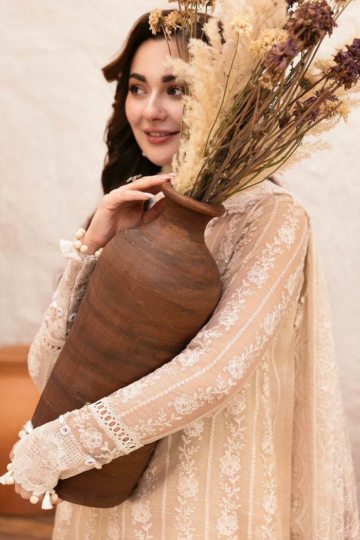 Model wearing beige embroidered shirt with lace detailing and matching floral dupatta from Saira Rizwan, Pakistani luxury pret, Pakistani clothes online in UK.