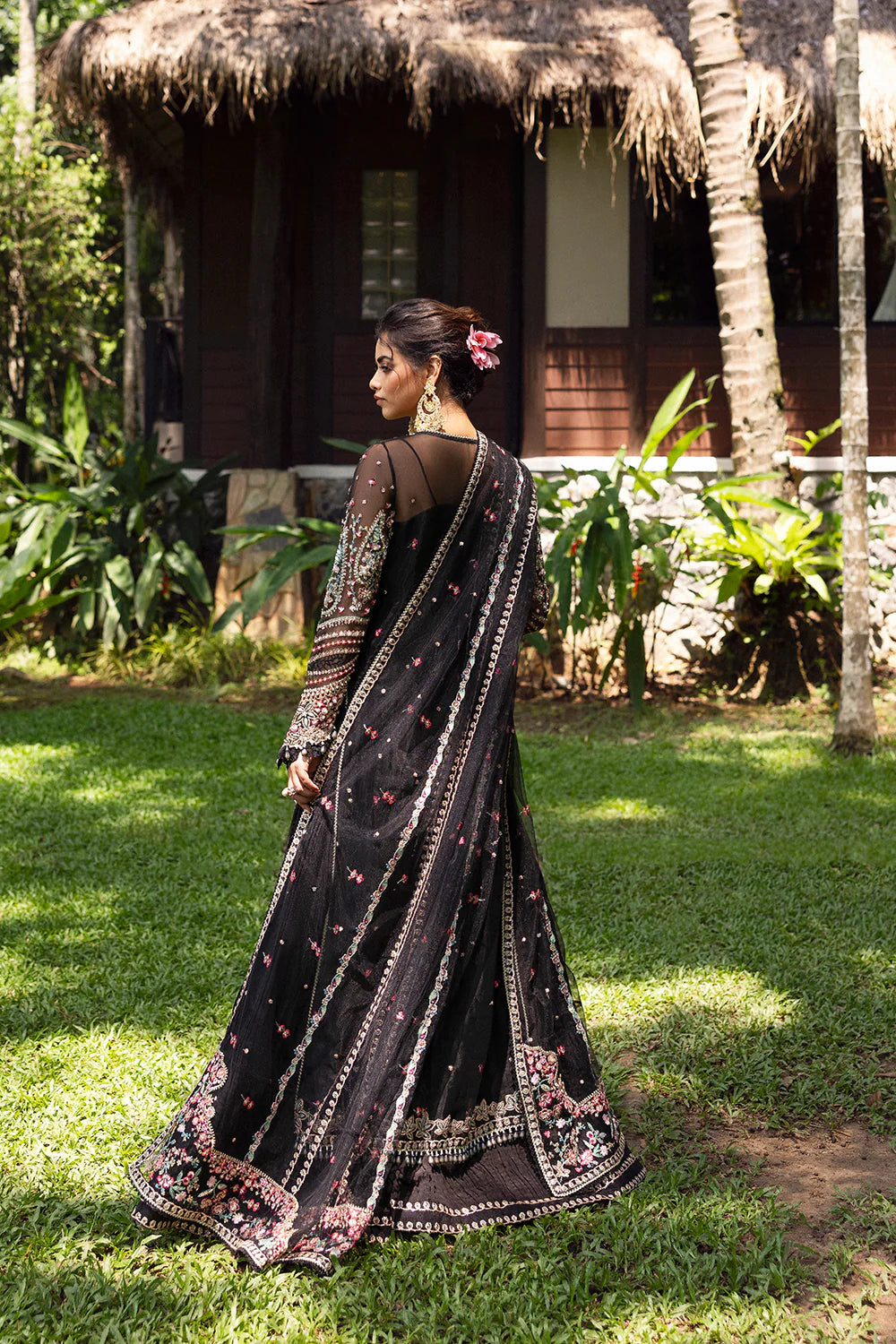 Model wearing Saira Rizwan AVINA-SRF25-02 in black with pastel floral embroidery – Pakistani luxury pret, shop online in UK.
