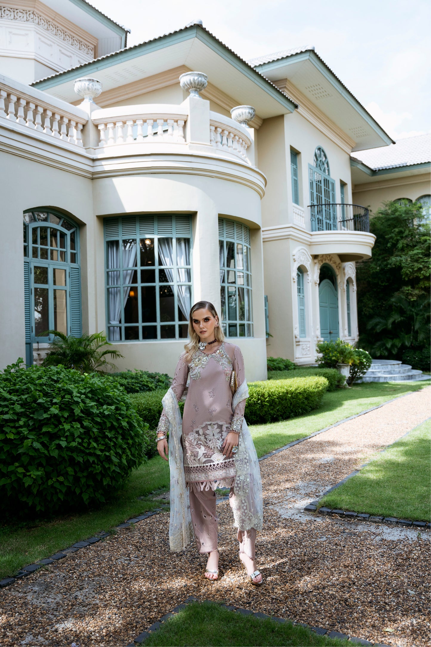 Model wearing Clara from Mysie by Tahira in beige luxury pret with intricate embroidery, perfect for Pakistani clothes online in UK.
