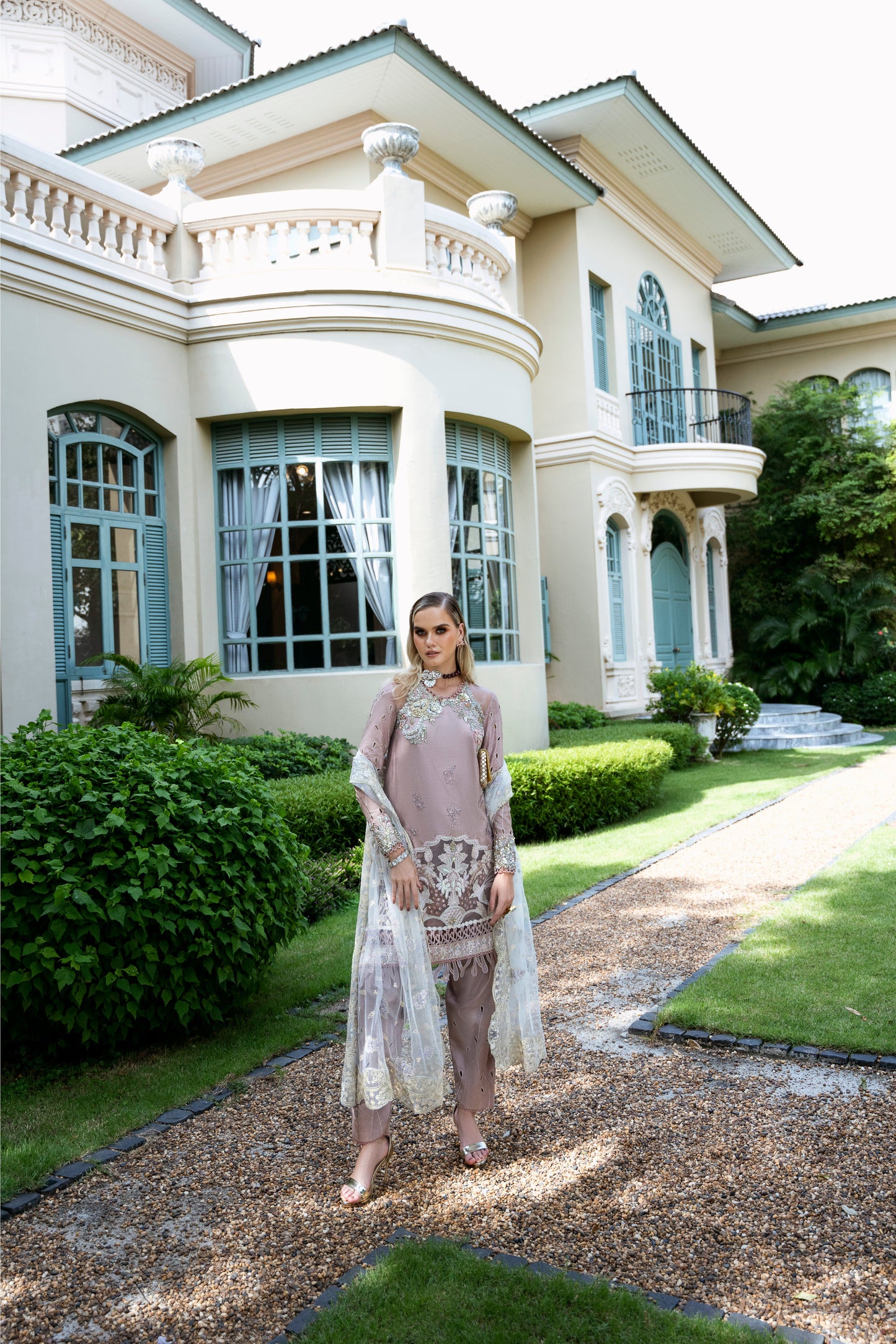 Model wearing Clara from Mysie by Tahira in beige luxury pret with intricate embroidery, perfect for Pakistani clothes online in UK.