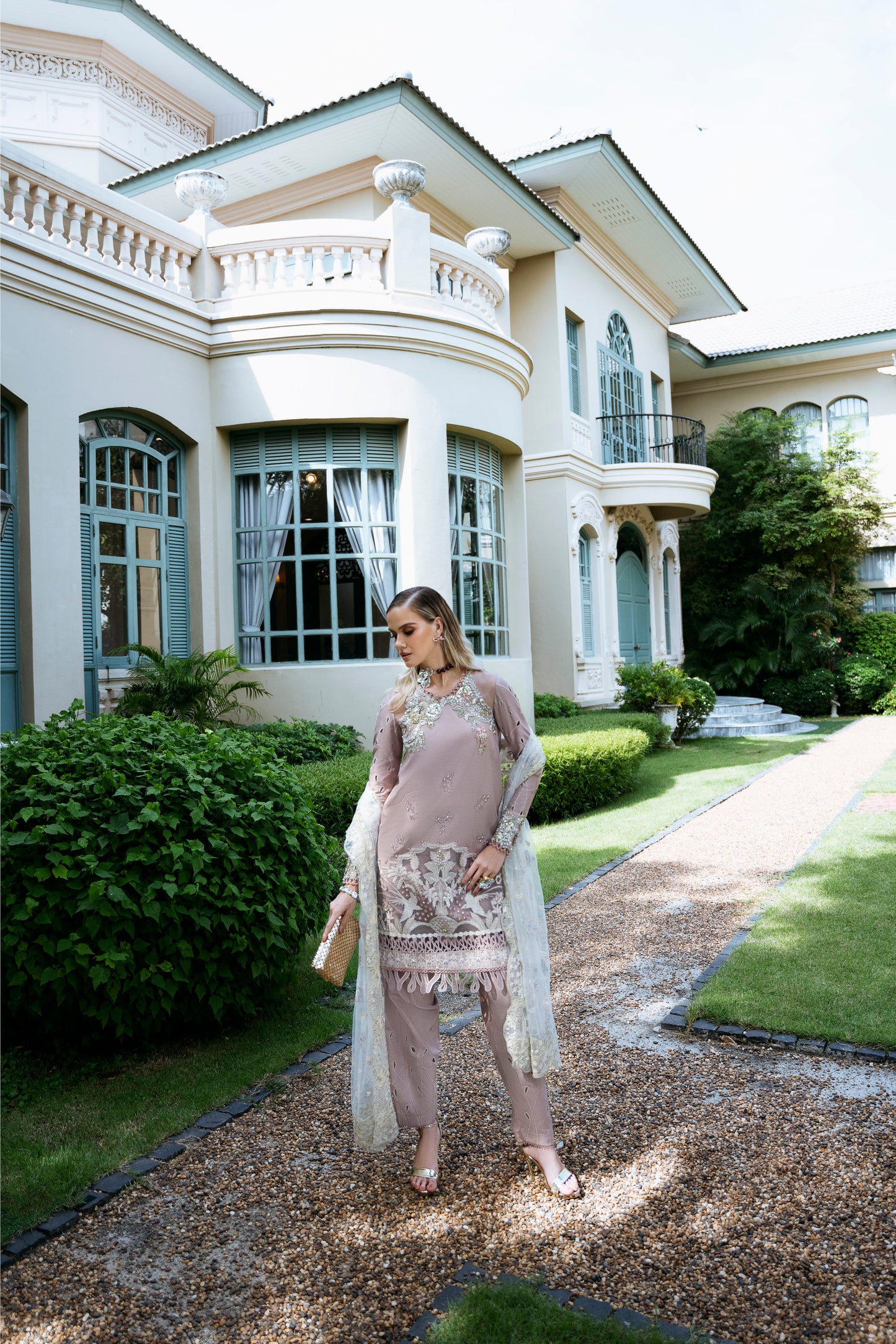 Model wearing Clara from Mysie by Tahira in beige luxury pret with intricate embroidery, perfect for Pakistani clothes online in UK.