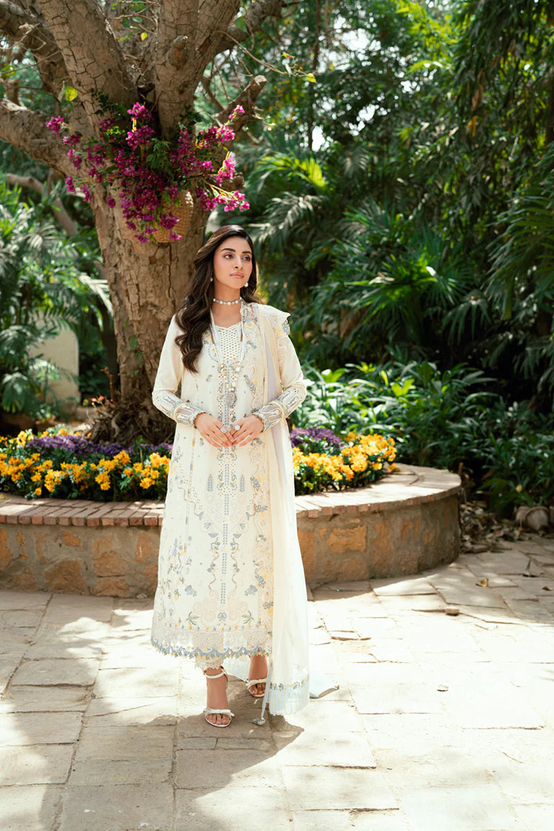 Model wearing ivory Qalamkar SB-09 Adeena embroidered outfit with sky blue accents, perfect for Eid and Pakistani luxury pret online in UK.