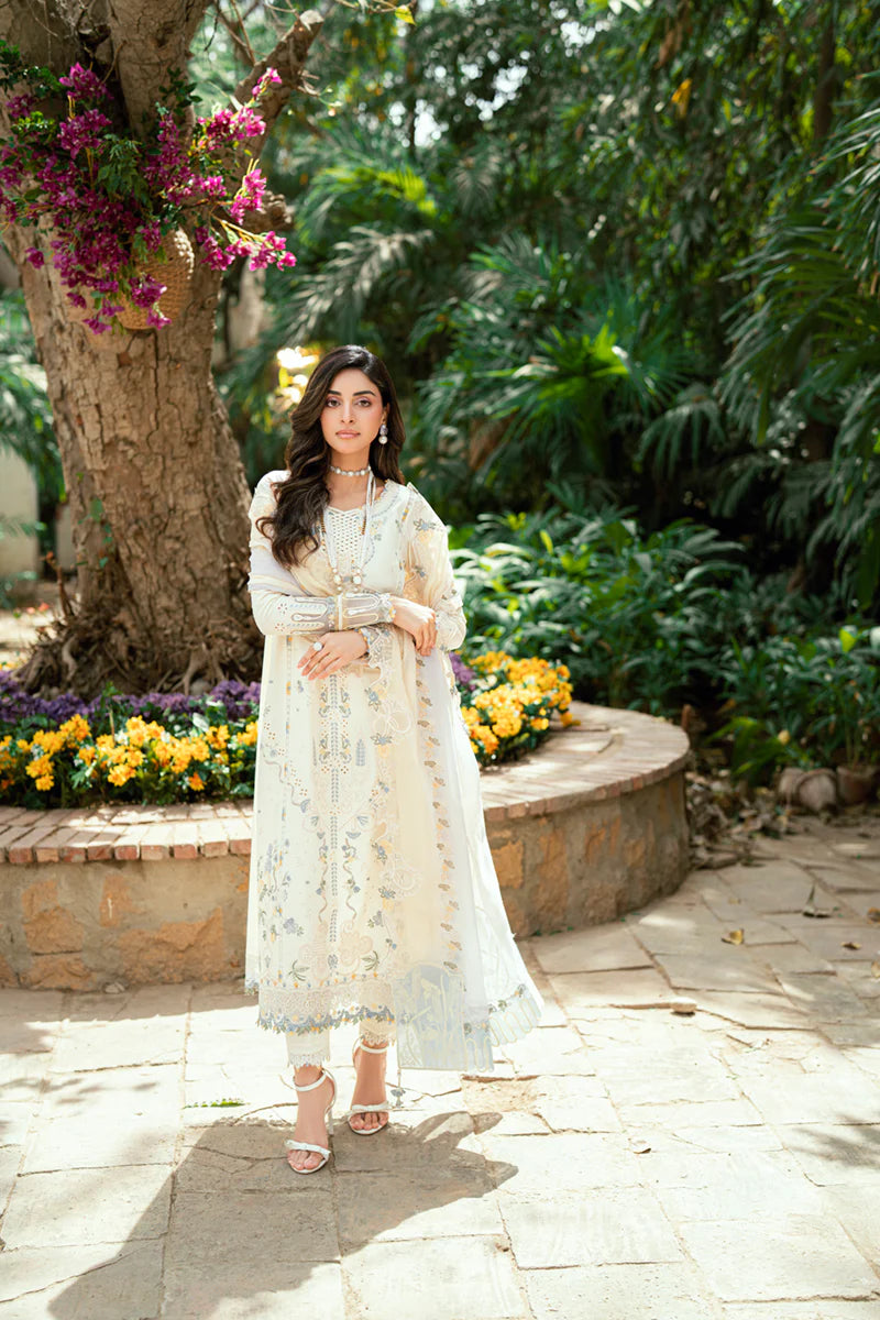 Model wearing ivory Qalamkar SB-09 Adeena embroidered outfit with sky blue accents, perfect for Eid and Pakistani luxury pret online in UK.
