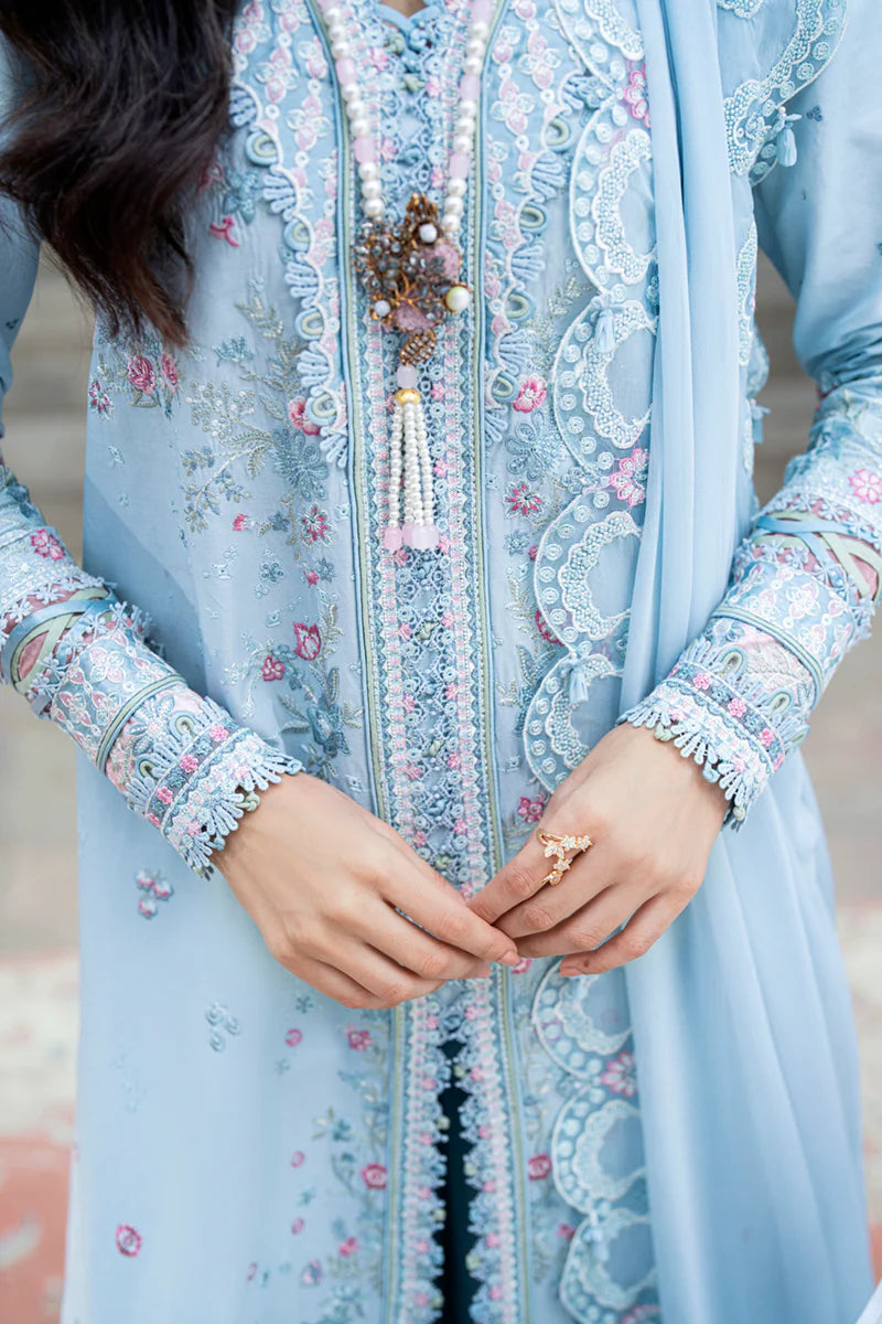Model wearing pastel blue Qalamkar SB-04 Zarish embroidered outfit, ideal for Eid celebrations and Pakistani luxury pret online in UK.