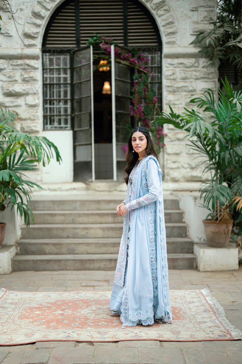 Model wearing pastel blue Qalamkar SB-04 Zarish embroidered outfit, ideal for Eid celebrations and Pakistani luxury pret online in UK.
