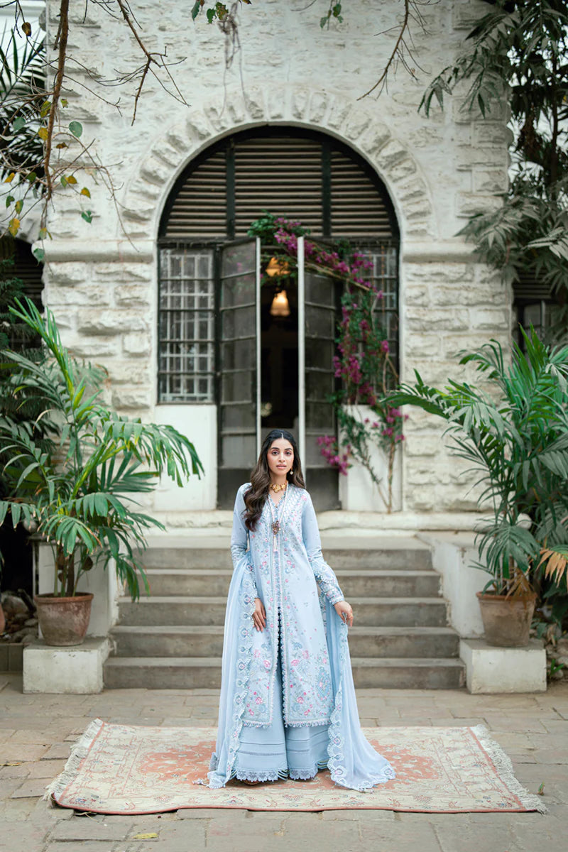 Model wearing pastel blue Qalamkar SB-04 Zarish embroidered outfit, ideal for Eid celebrations and Pakistani luxury pret online in UK.