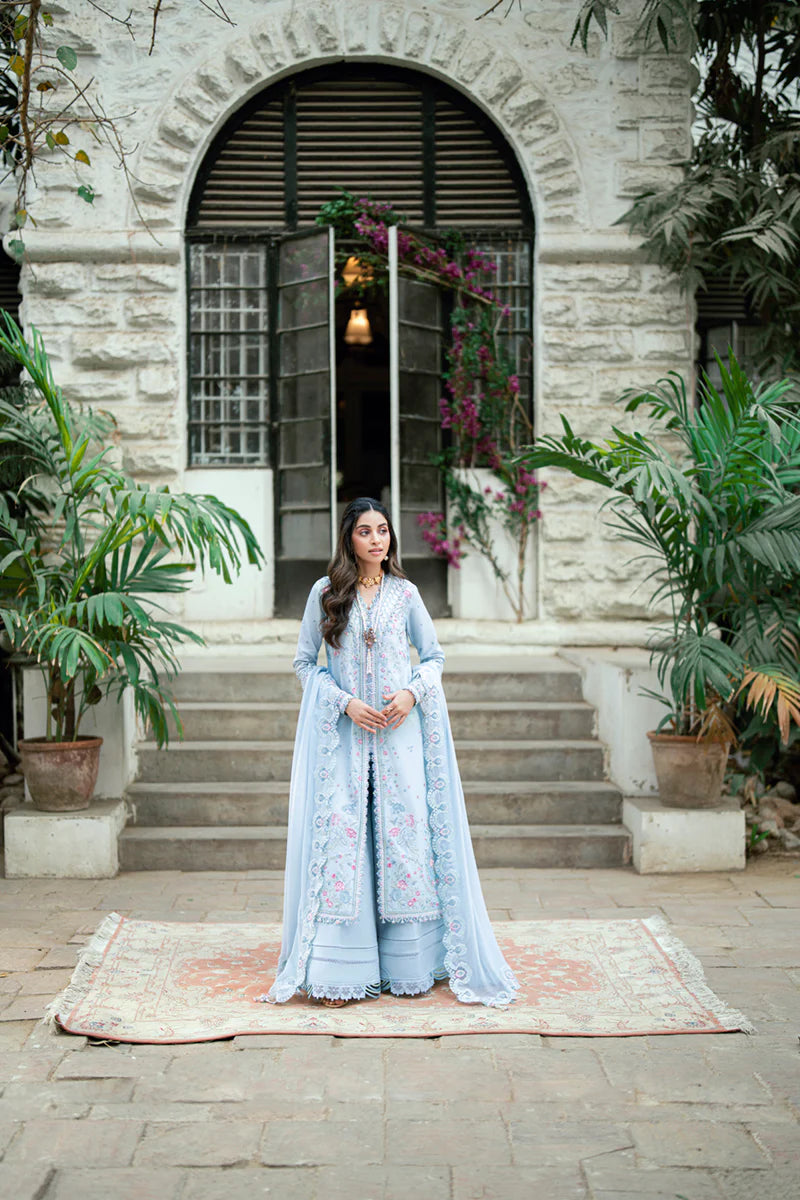 Model wearing pastel blue Qalamkar SB-04 Zarish embroidered outfit, ideal for Eid celebrations and Pakistani luxury pret online in UK.