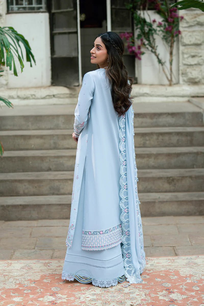 Model wearing pastel blue Qalamkar SB-04 Zarish embroidered outfit, ideal for Eid celebrations and Pakistani luxury pret online in UK.