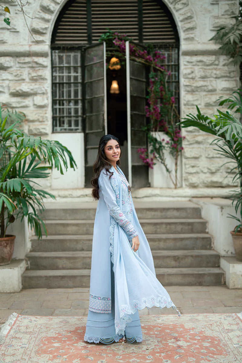 Model wearing pastel blue Qalamkar SB-04 Zarish embroidered outfit, ideal for Eid celebrations and Pakistani luxury pret online in UK.