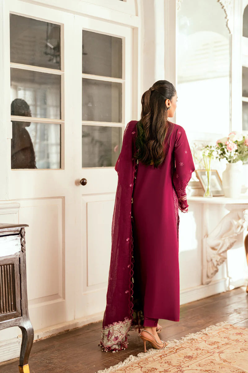 Model wearing maroon Qalamkar SB-02 Sameen embroidered outfit, ideal for Eid festivities and Pakistani luxury pret online in UK.