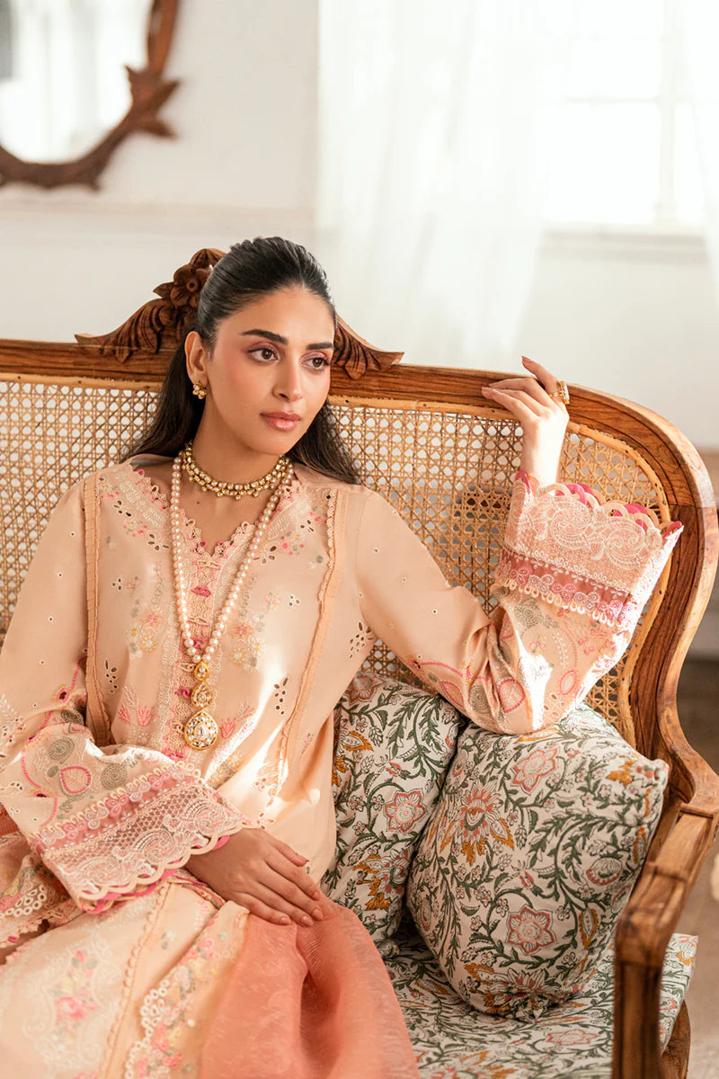 Model wearing peach Qalamkar SB-07 Zoya embroidered suit with floral detailing, perfect for Eid and Pakistani luxury pret online in UK.