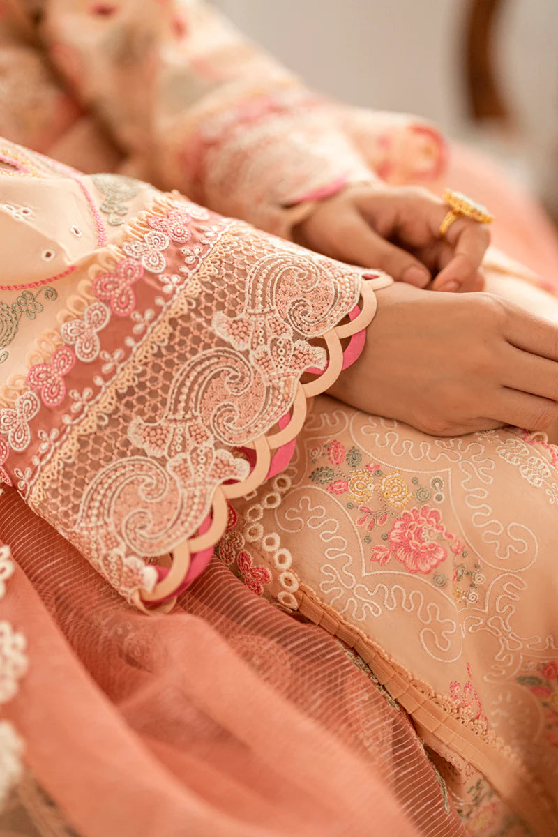 Model wearing peach Qalamkar SB-07 Zoya embroidered suit with floral detailing, perfect for Eid and Pakistani luxury pret online in UK.