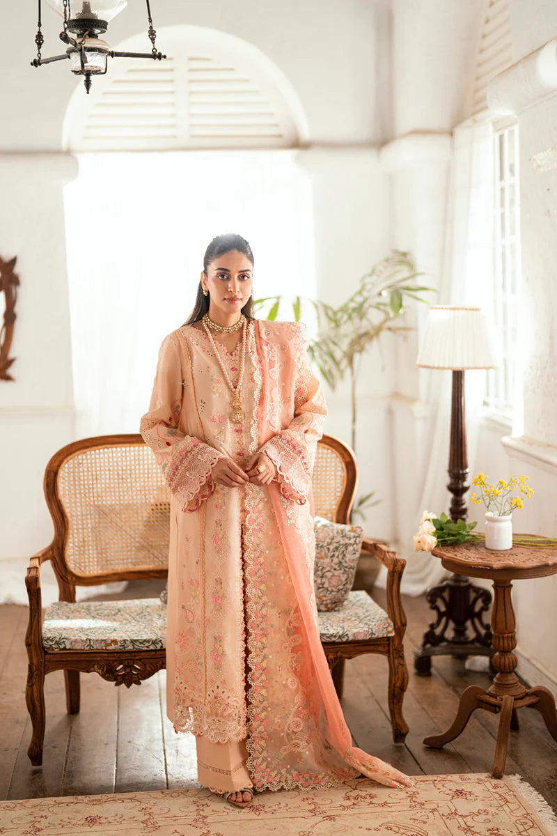 Model wearing peach Qalamkar SB-07 Zoya embroidered suit with floral detailing, perfect for Eid and Pakistani luxury pret online in UK.