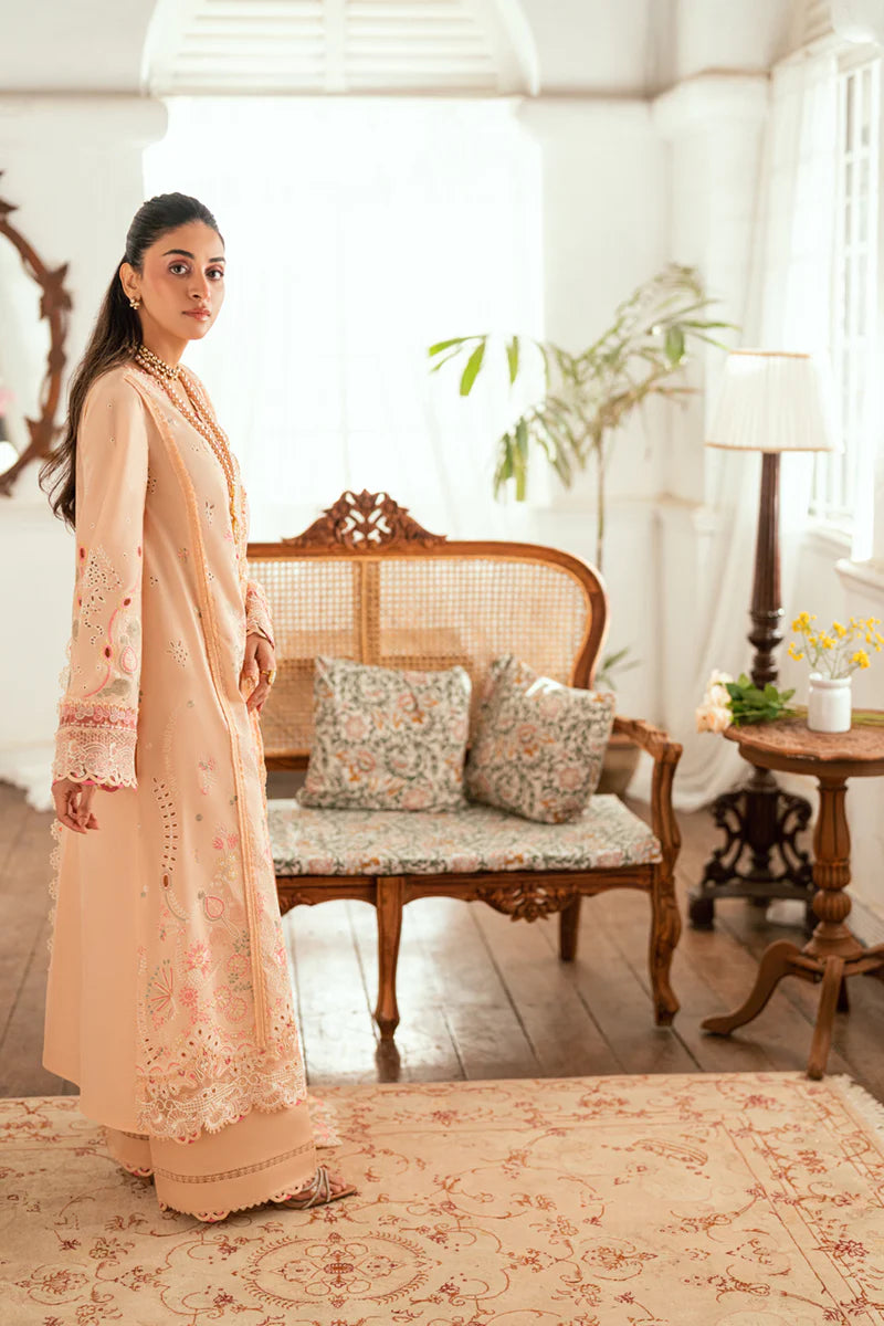 Model wearing peach Qalamkar SB-07 Zoya embroidered suit with floral detailing, perfect for Eid and Pakistani luxury pret online in UK.