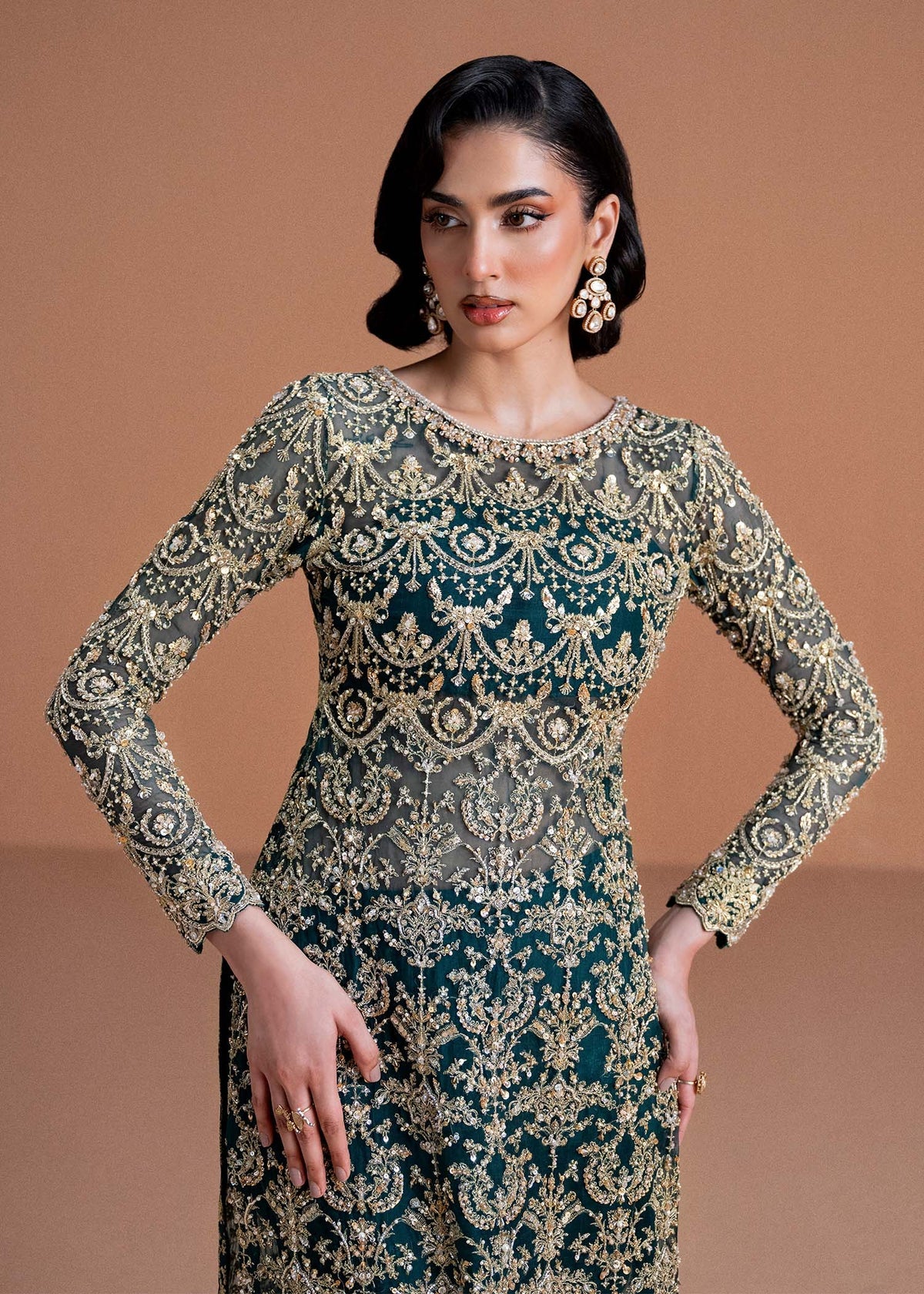 Model wearing deep green and gold Zaira dress from Kanwal Malik, ideal for Pakistani luxury pret and Pakistani clothes online in UK.