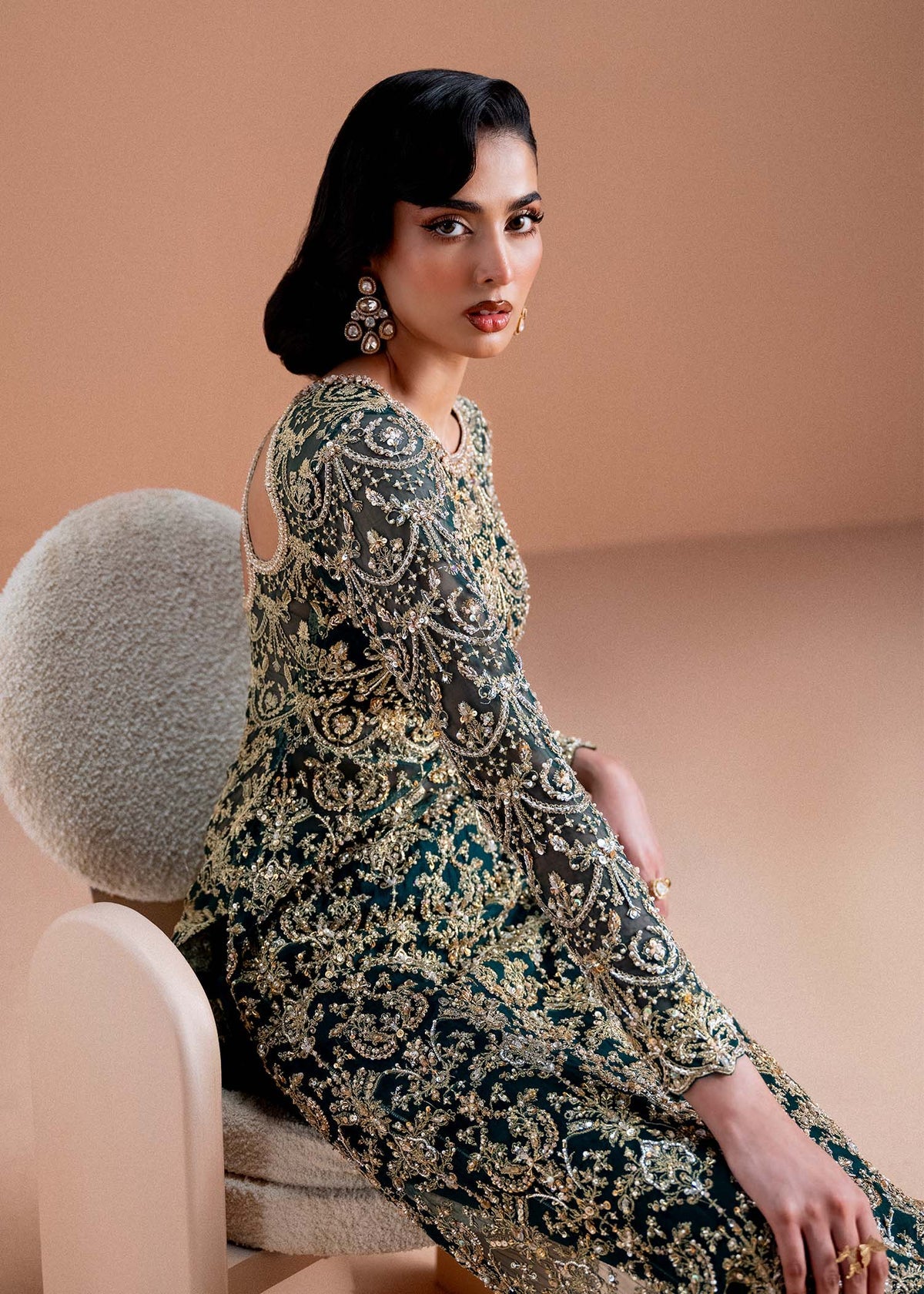 Model wearing deep green and gold Zaira dress from Kanwal Malik, ideal for Pakistani luxury pret and Pakistani clothes online in UK.