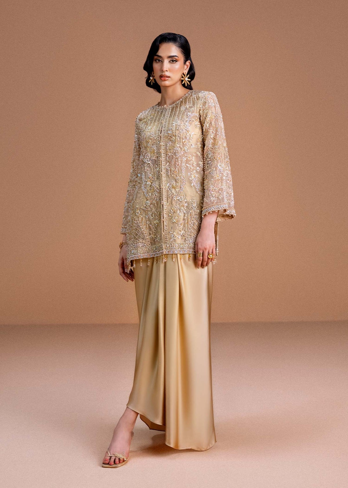 Model wearing gold Aurelia outfit from Kanwal Malik, perfect for Pakistani luxury pret and Pakistani clothes online in UK.