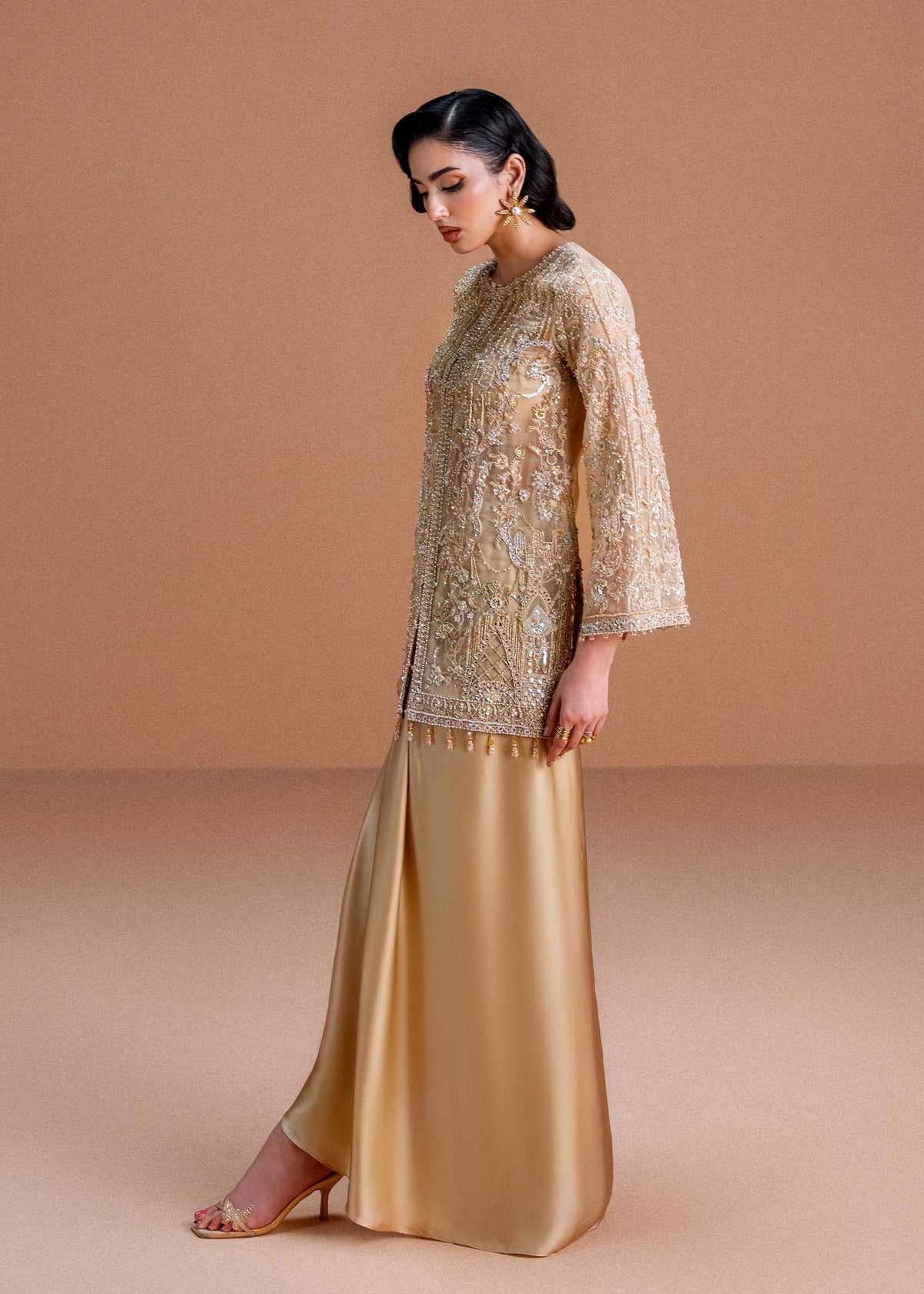 Model wearing gold Aurelia outfit from Kanwal Malik, perfect for Pakistani luxury pret and Pakistani clothes online in UK.