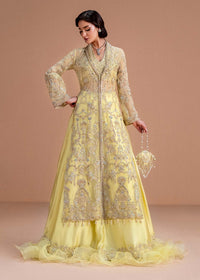 Model wearing lemon yellow Meira outfit from Kanwal Malik, featuring intricate embellishments for Pakistani luxury pret and clothes online in UK.