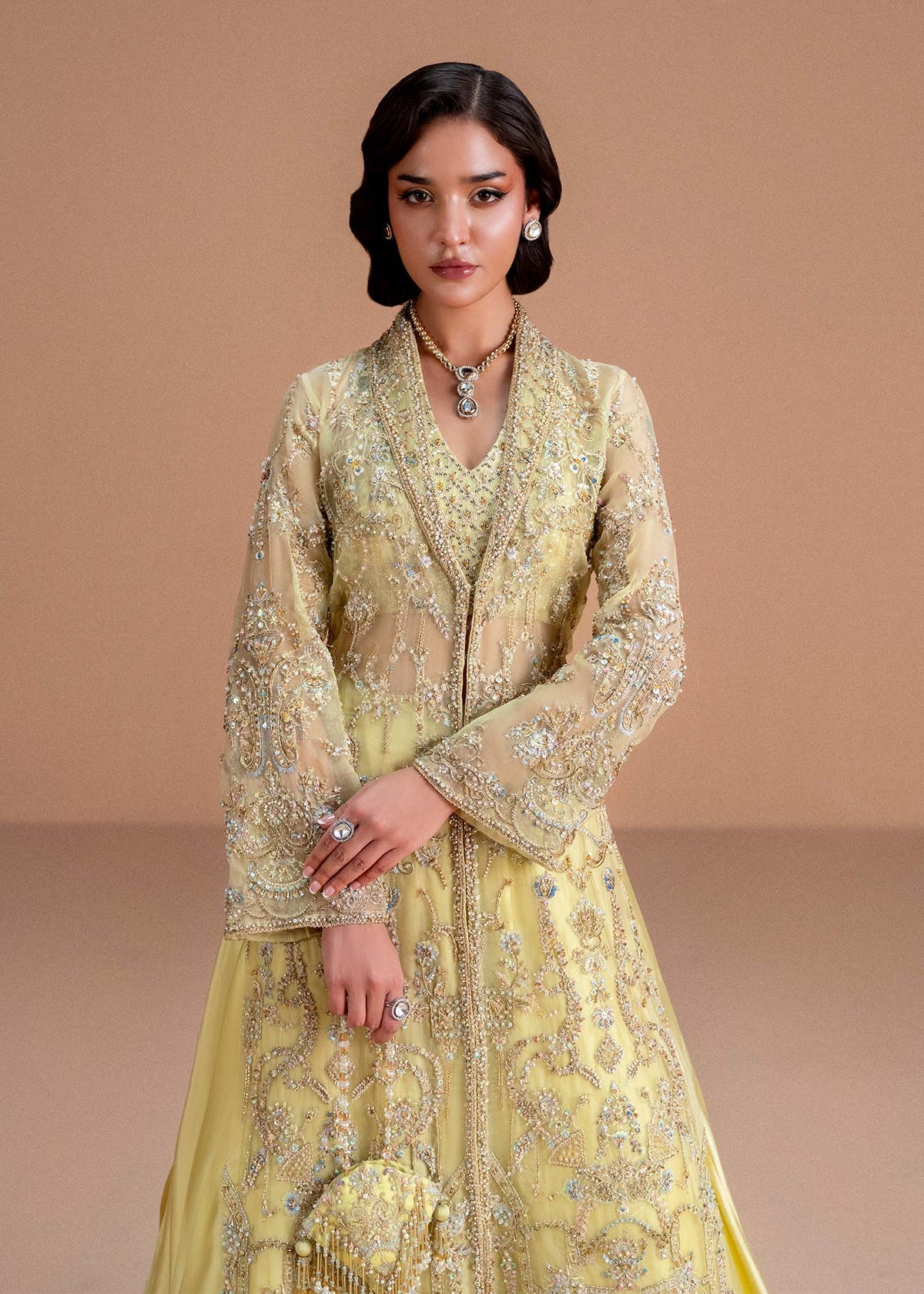 Model wearing lemon yellow Meira outfit from Kanwal Malik, featuring intricate embellishments for Pakistani luxury pret and clothes online in UK.