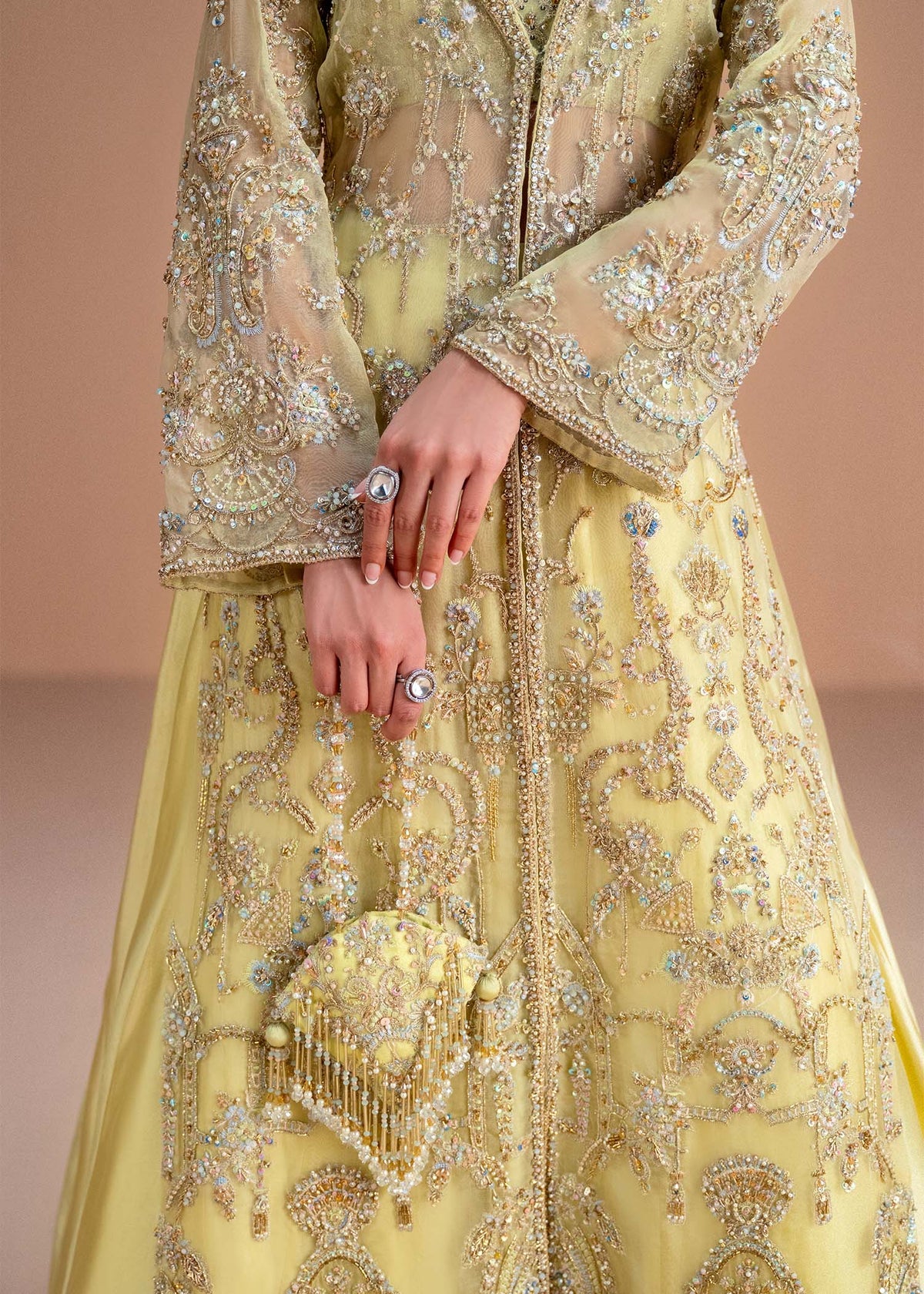 Model wearing lemon yellow Meira outfit from Kanwal Malik, featuring intricate embellishments for Pakistani luxury pret and clothes online in UK.