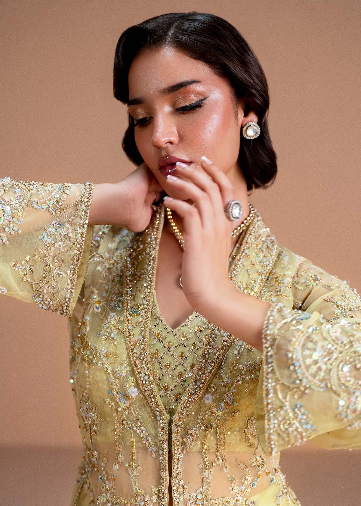 Model wearing lemon yellow Meira outfit from Kanwal Malik, featuring intricate embellishments for Pakistani luxury pret and clothes online in UK.
