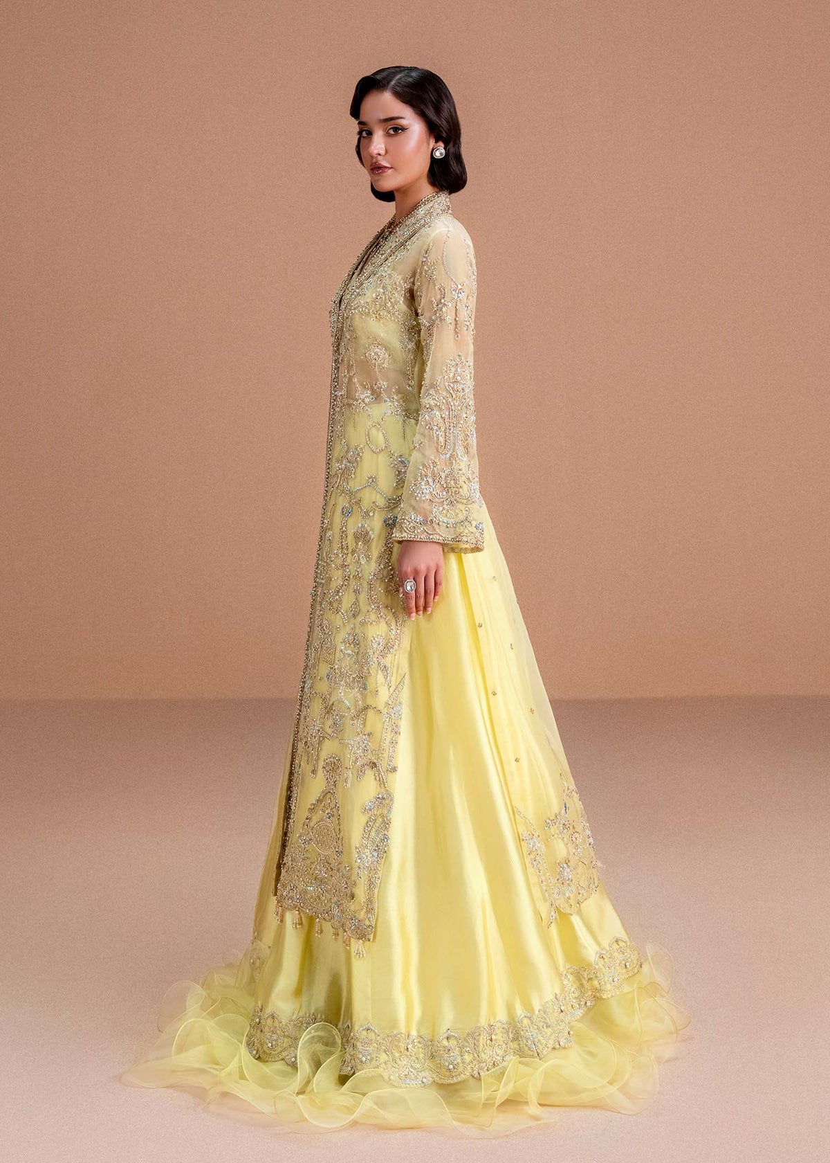 Model wearing lemon yellow Meira outfit from Kanwal Malik, featuring intricate embellishments for Pakistani luxury pret and clothes online in UK.