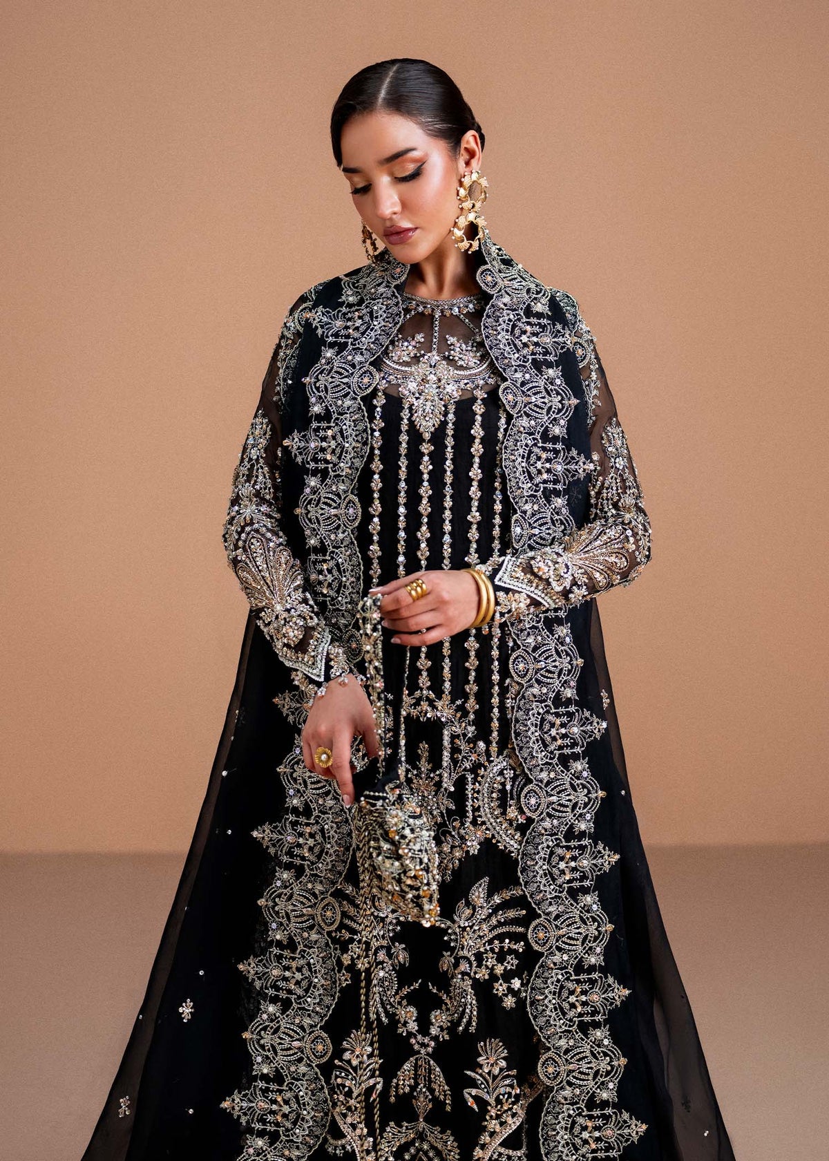 Model wearing black Rayen outfit from Kanwal Malik, showcasing intricate embroidery for Pakistani luxury pret and clothes online in UK.