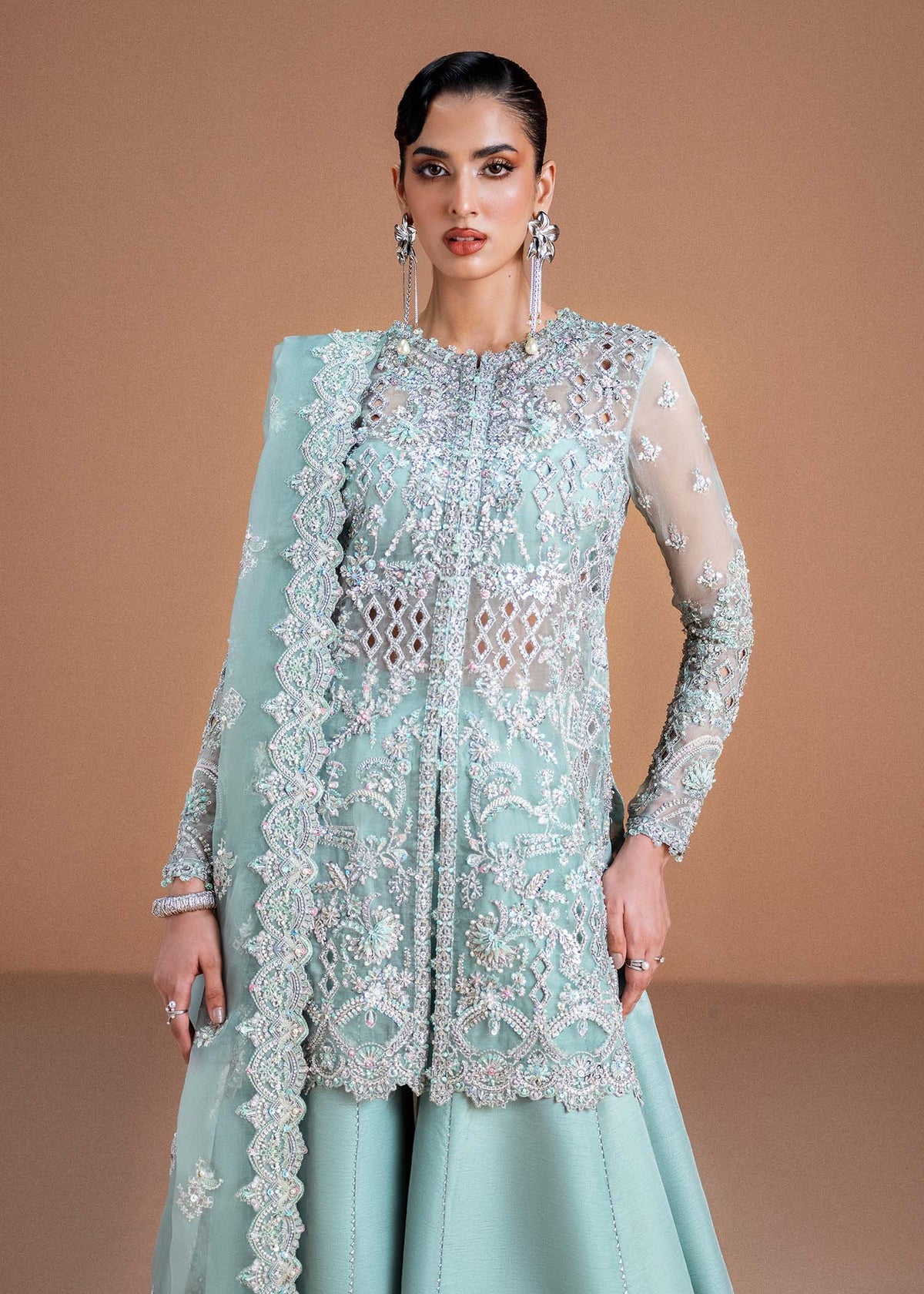 Model wearing mint green Vania outfit from Kanwal Malik, featuring delicate embroidery for Pakistani luxury pret and clothes online in UK.