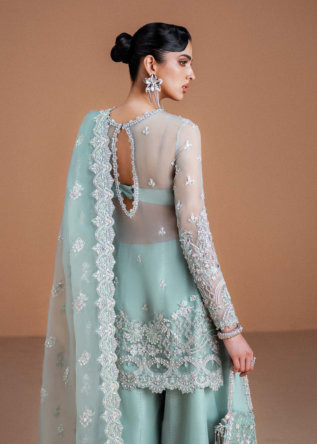 Model wearing mint green Vania outfit from Kanwal Malik, featuring delicate embroidery for Pakistani luxury pret and clothes online in UK.