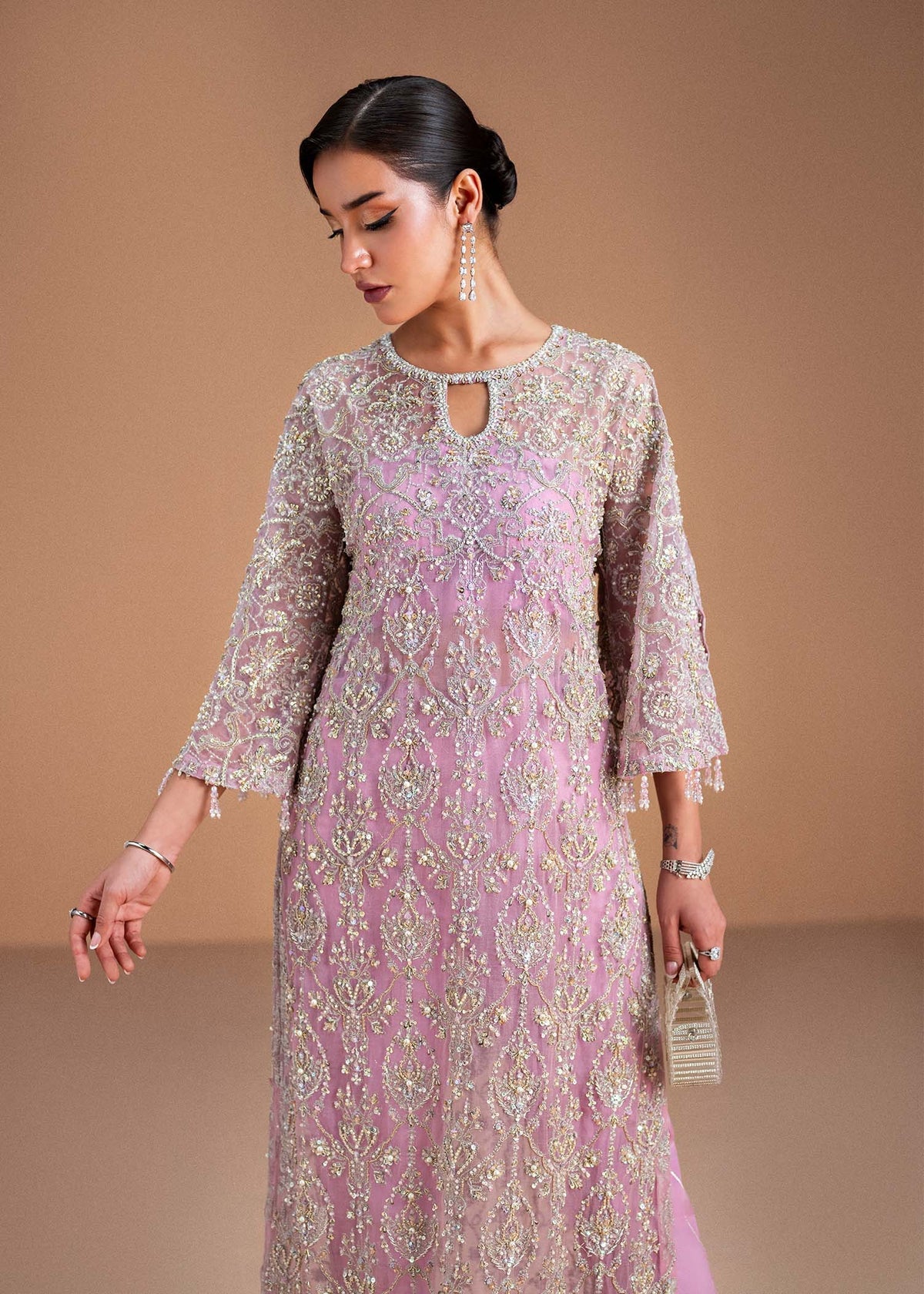 Model wearing blush pink Dina outfit from Kanwal Malik, showcasing intricate handwork for Pakistani luxury pret and clothes online in UK.