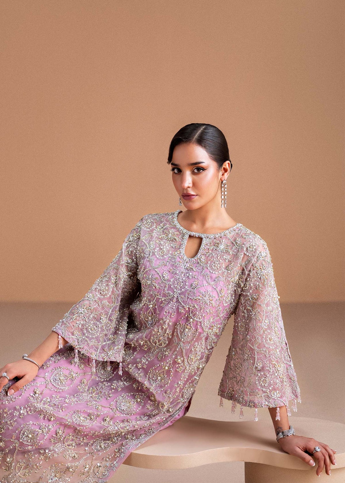 Model wearing blush pink Dina outfit from Kanwal Malik, showcasing intricate handwork for Pakistani luxury pret and clothes online in UK.