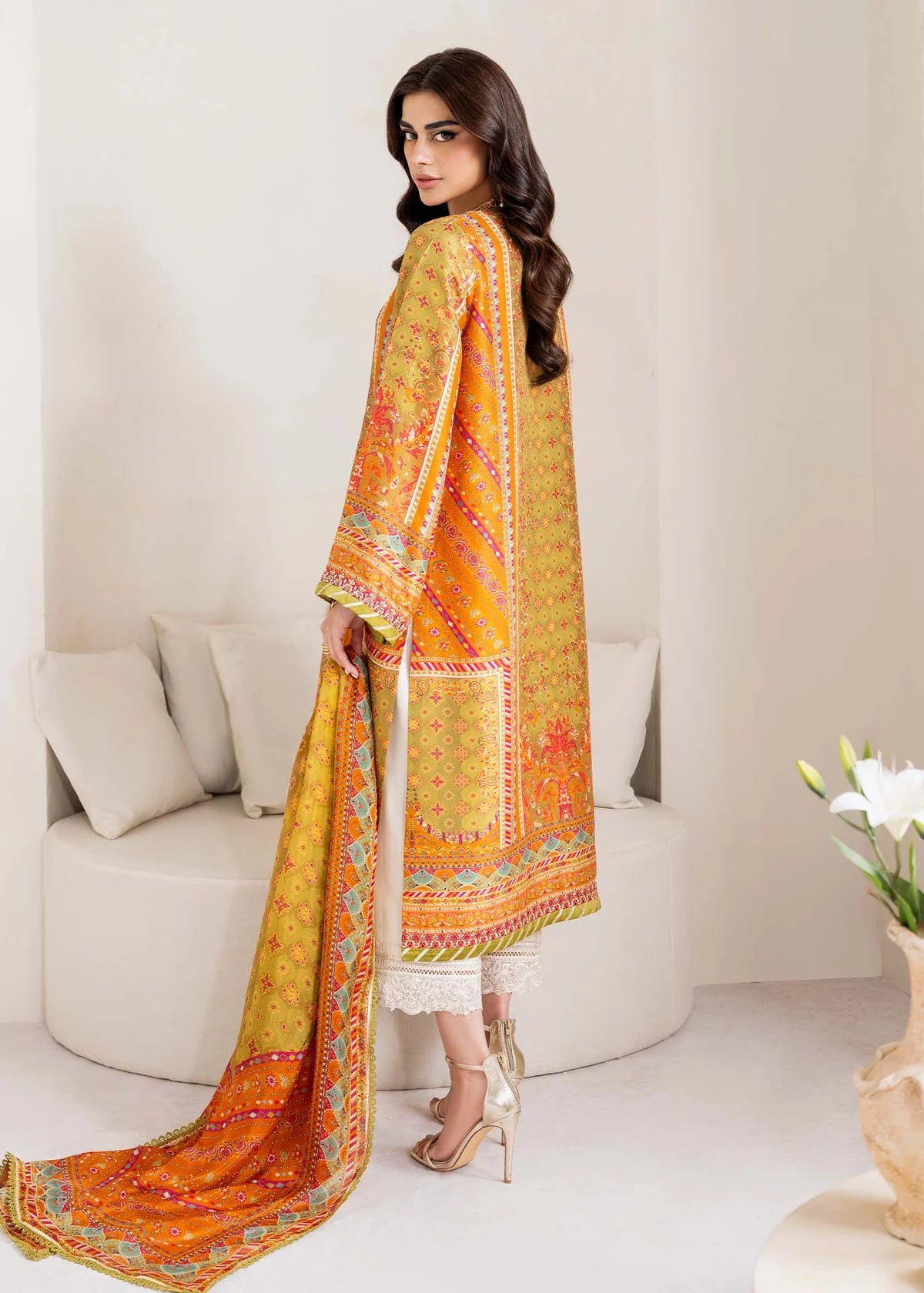 Model wearing olive and orange Elise from Kanwal Malik Rosalia Silk Eid Collection '25, Pakistani luxury pret and clothes online in UK.