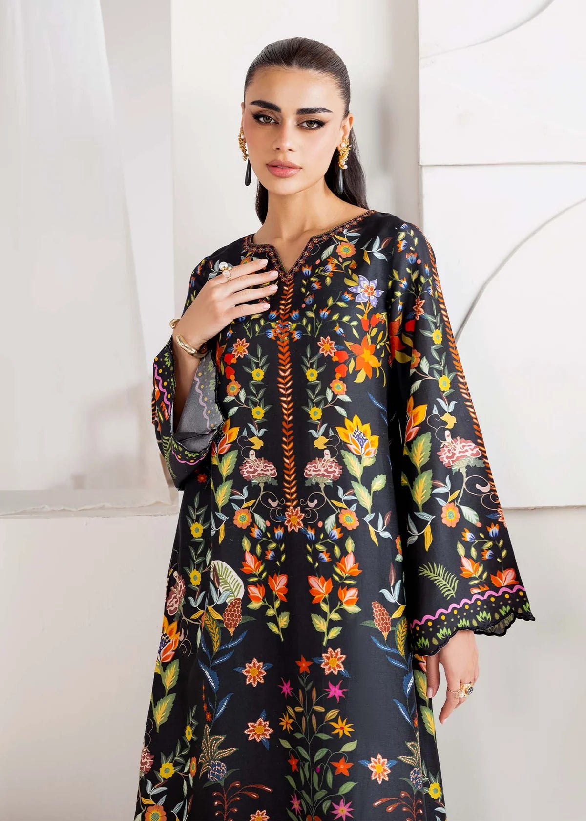 Model wearing black multicolour floral Kanwal Malik Sovana from Rosalia Silk Eid Collection '25, Pakistani luxury pret online in UK.