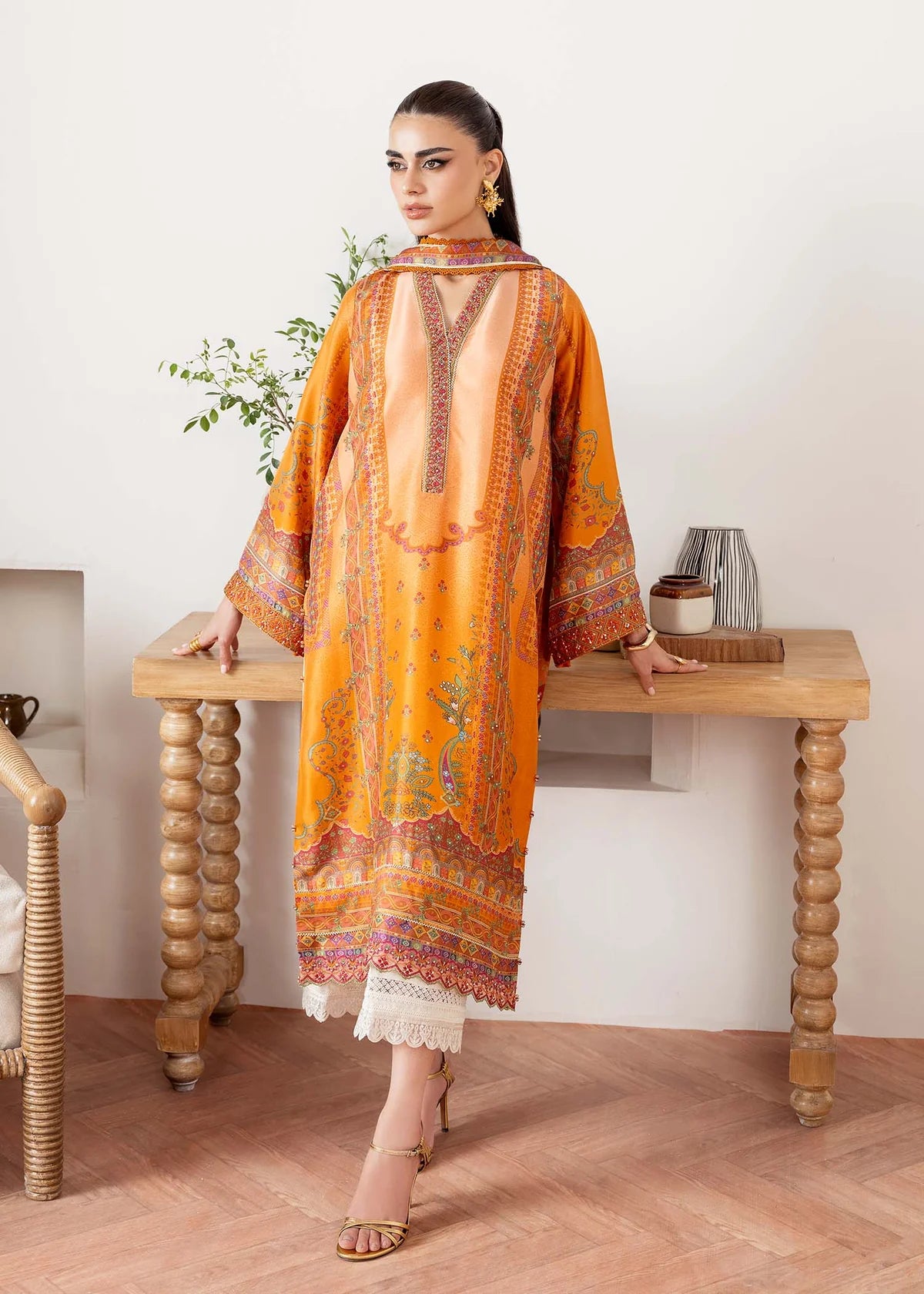 Model wearing orange Kira from Kanwal Malik Rosalia Silk Eid Collection '25, Pakistani luxury pret suit available online in UK.