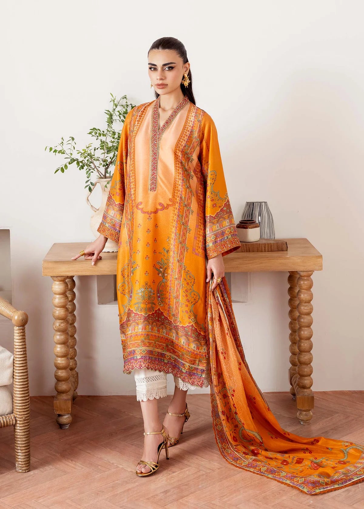 Model wearing orange Kira from Kanwal Malik Rosalia Silk Eid Collection '25, Pakistani luxury pret suit available online in UK.