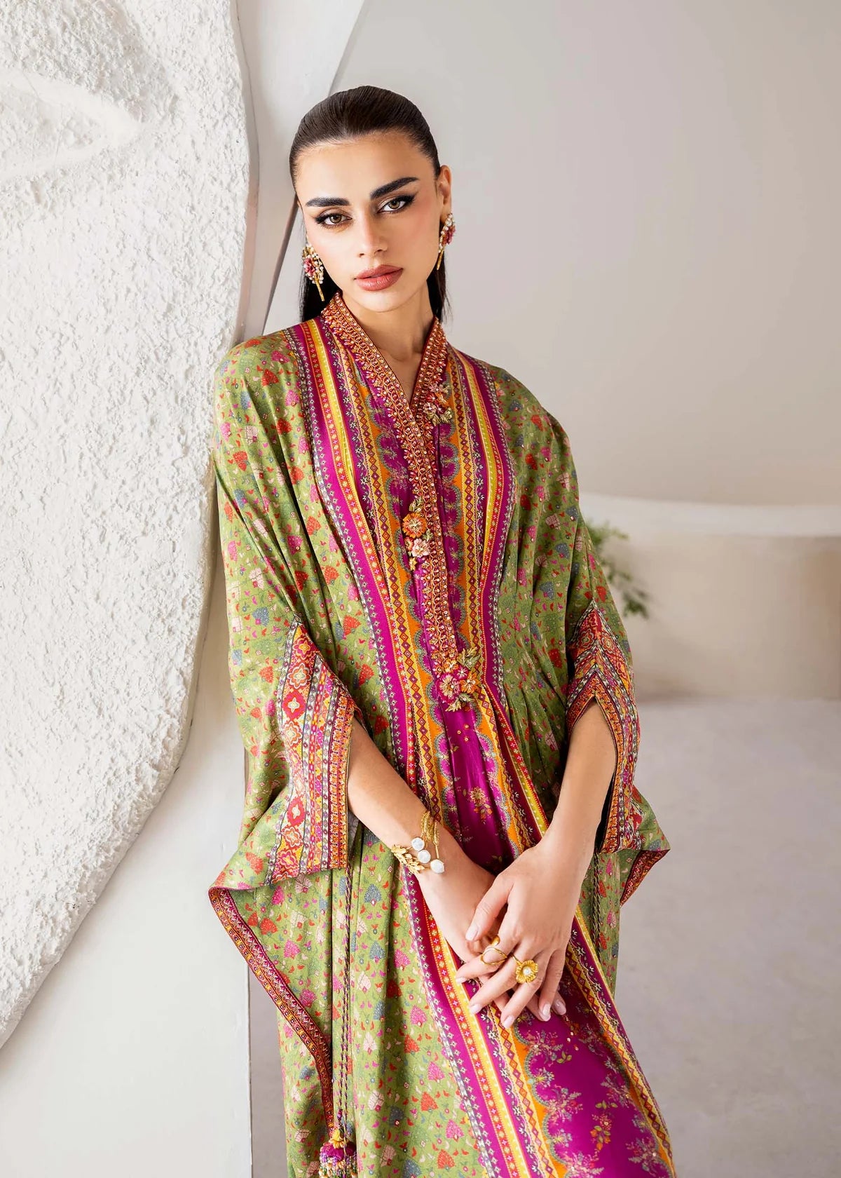Model wearing green and magenta Deja from Kanwal Malik Rosalia Silk Eid Collection '25, Pakistani luxury pret available online in UK.