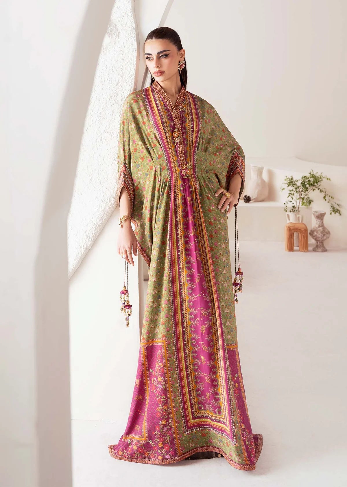 Model wearing green and magenta Deja from Kanwal Malik Rosalia Silk Eid Collection '25, Pakistani luxury pret available online in UK.