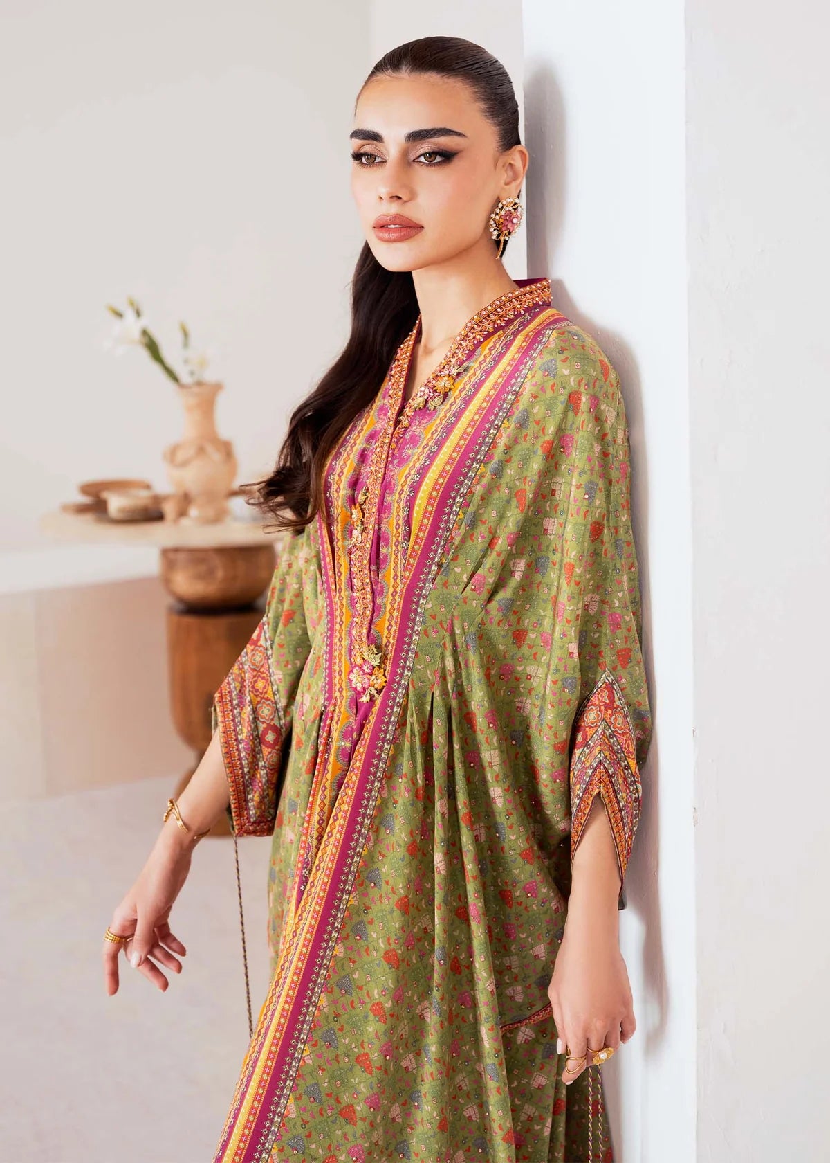 Model wearing green and magenta Deja from Kanwal Malik Rosalia Silk Eid Collection '25, Pakistani luxury pret available online in UK.