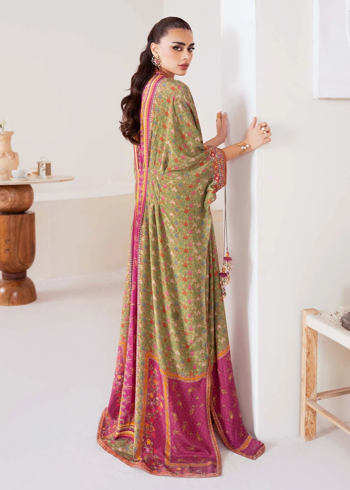 Model wearing green and magenta Deja from Kanwal Malik Rosalia Silk Eid Collection '25, Pakistani luxury pret available online in UK.